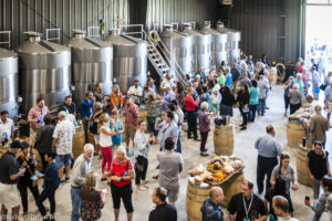 Group of people at Vintage Pour tasting in Doubleback production facility.
