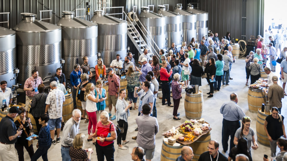 Group of people at Vintage Pour tasting in Doubleback production facility.