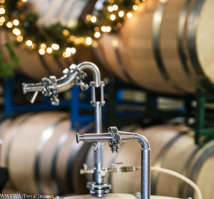 Holiday Barrel Tasting Weekend, a barrel shot with decorative twinkle lights in the background