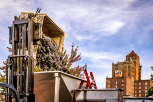 Grapes being dumped with the Marcus Whitman Hotel in the background