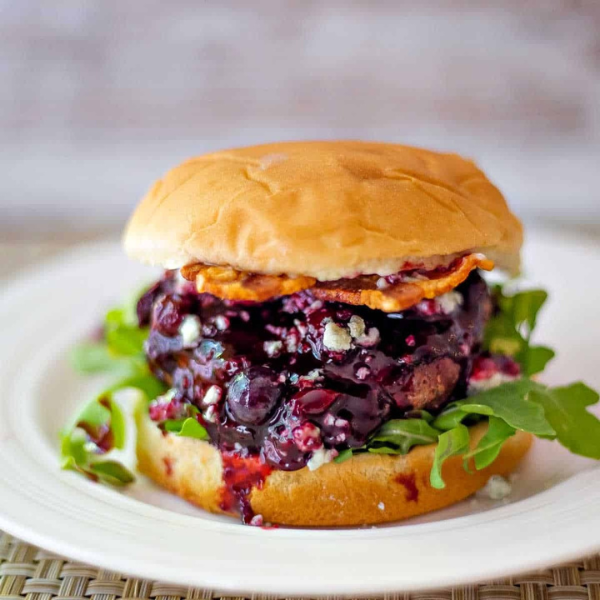 Blueberry blue cheese bacon burger with arugula paired with Amavi Cellars Walla Walla Syrah